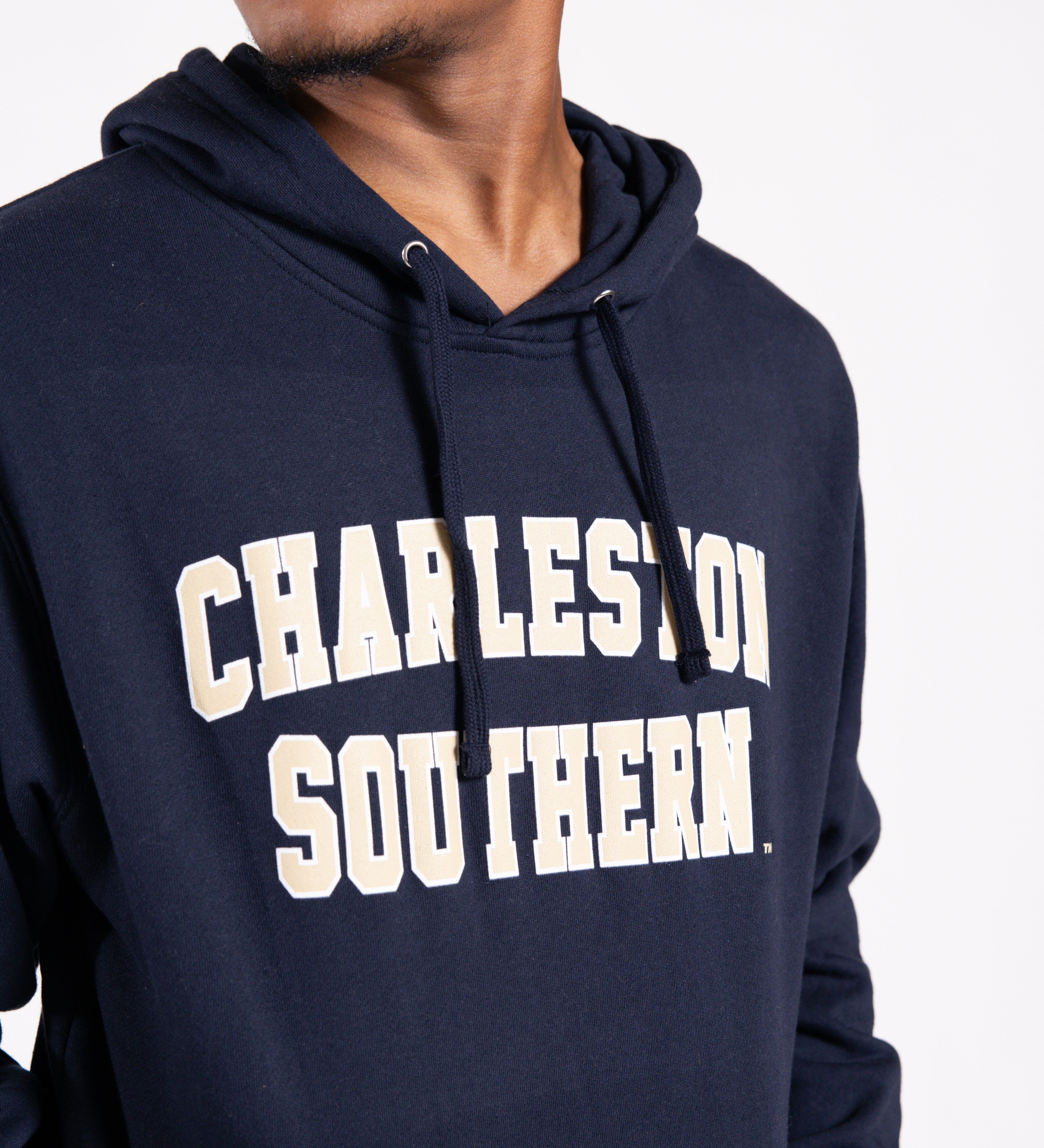 Person wearing a navy hoodie with 'Charleston Southern' text on a white background