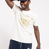Man wearing a white t-shirt with a logo and navy pants, posing against a white background