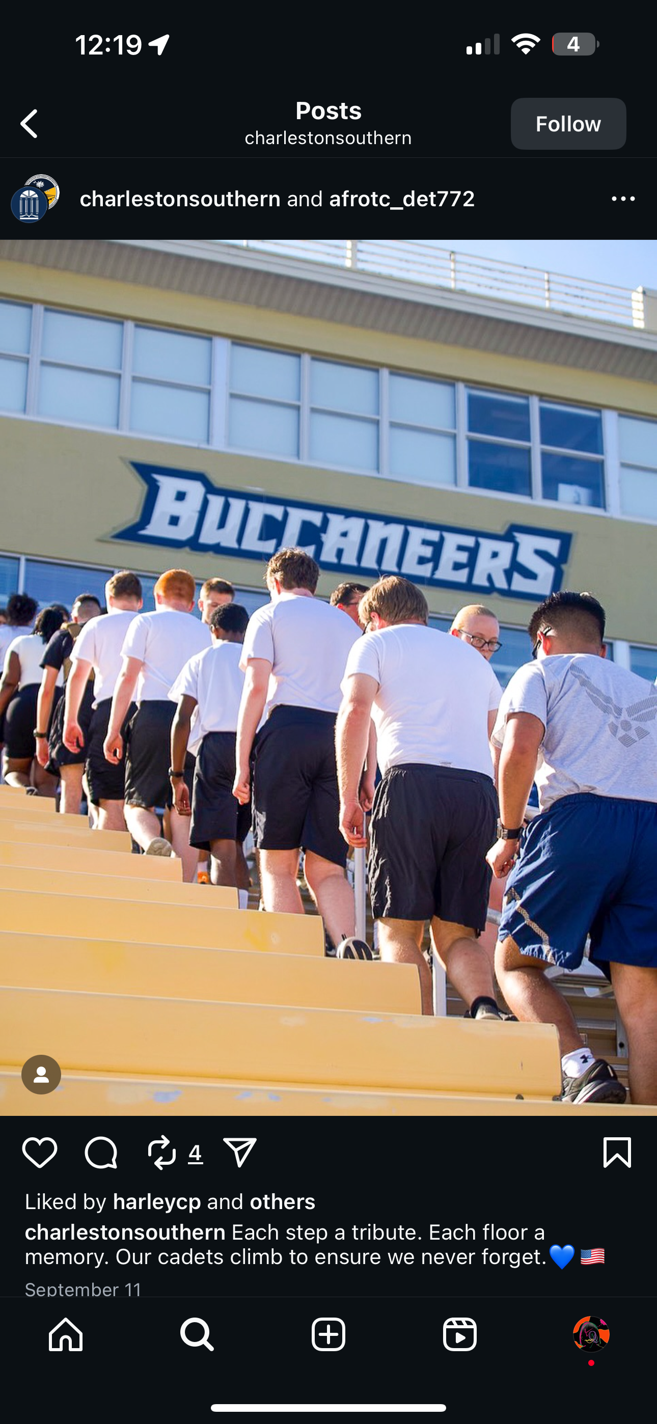 Group of people in athletic wear standing in front of a building with 'Buccaneers' branding.