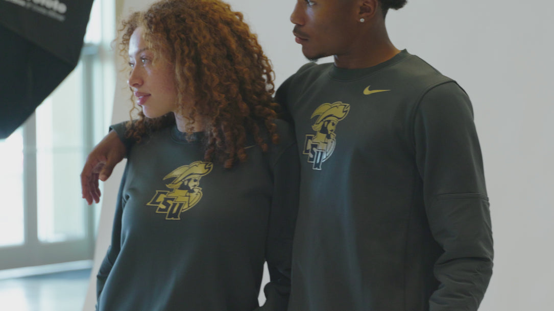 A man and woman wearing matching CSU gray crewnecks